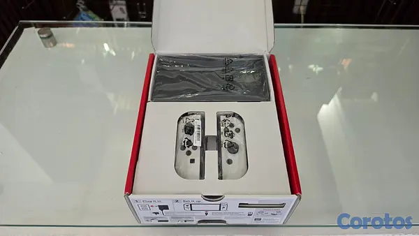 consolas y videojuegos - Nintendo Switch OLED blanco en su caja con sus pla 2