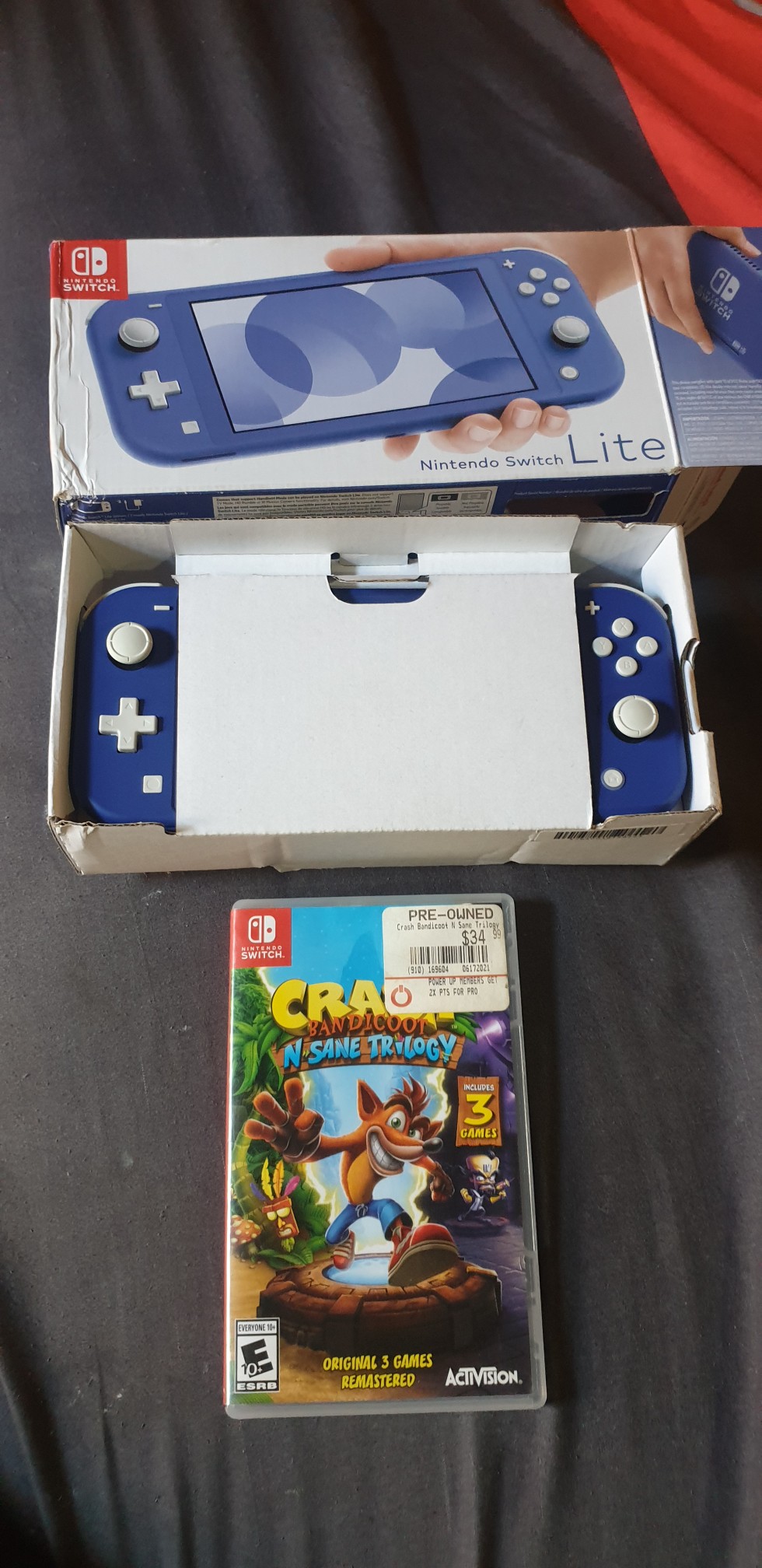 consolas y videojuegos - Nintendo switch lite azul+juego. Su Caja y cargador original.