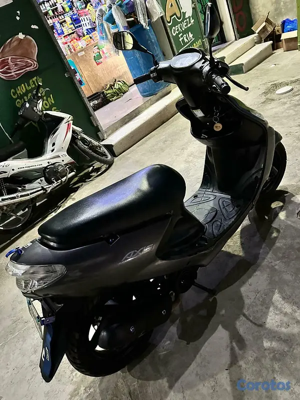 motores y pasolas - Honda Grand Axis 100 4